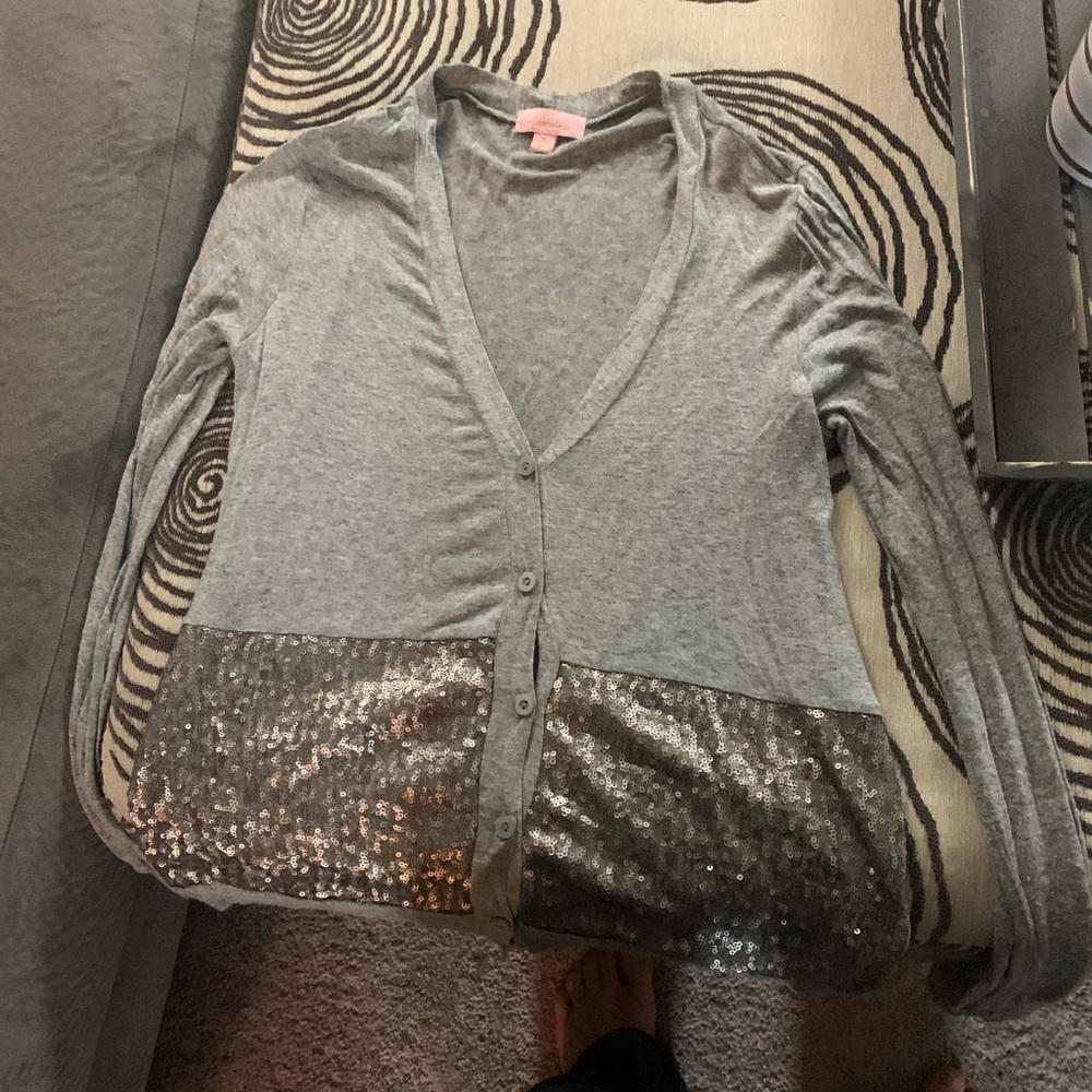 Light grey sequenced sweater.
